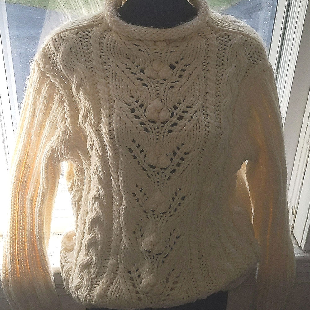 Express chunky open weave trending sweater with rolled mock turtle neck.